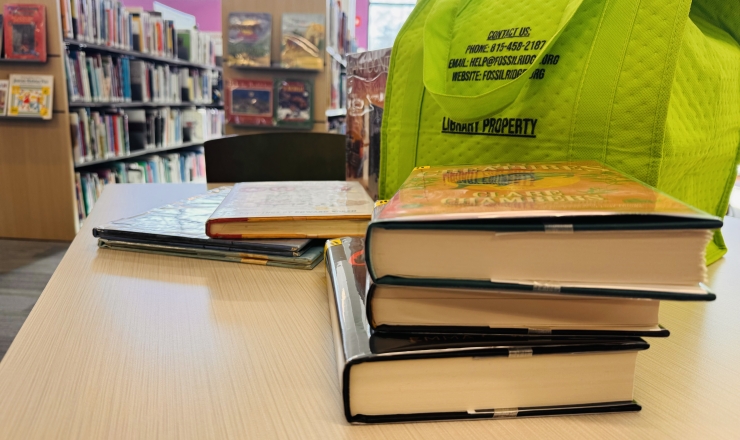 Lime green At Home Delivery bag and books on table